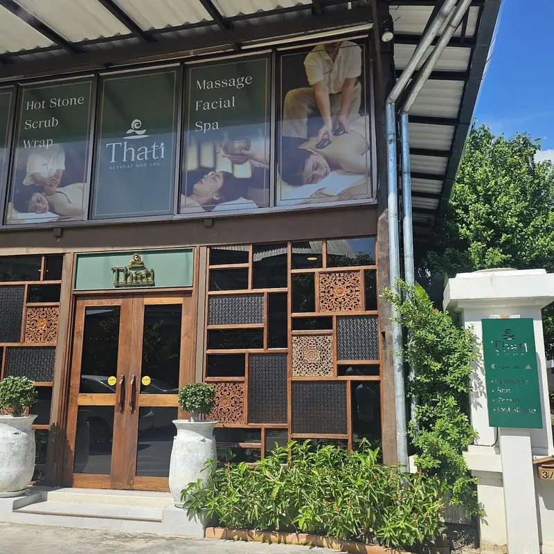 The THATI shopfront with carved lattice screens and green signage